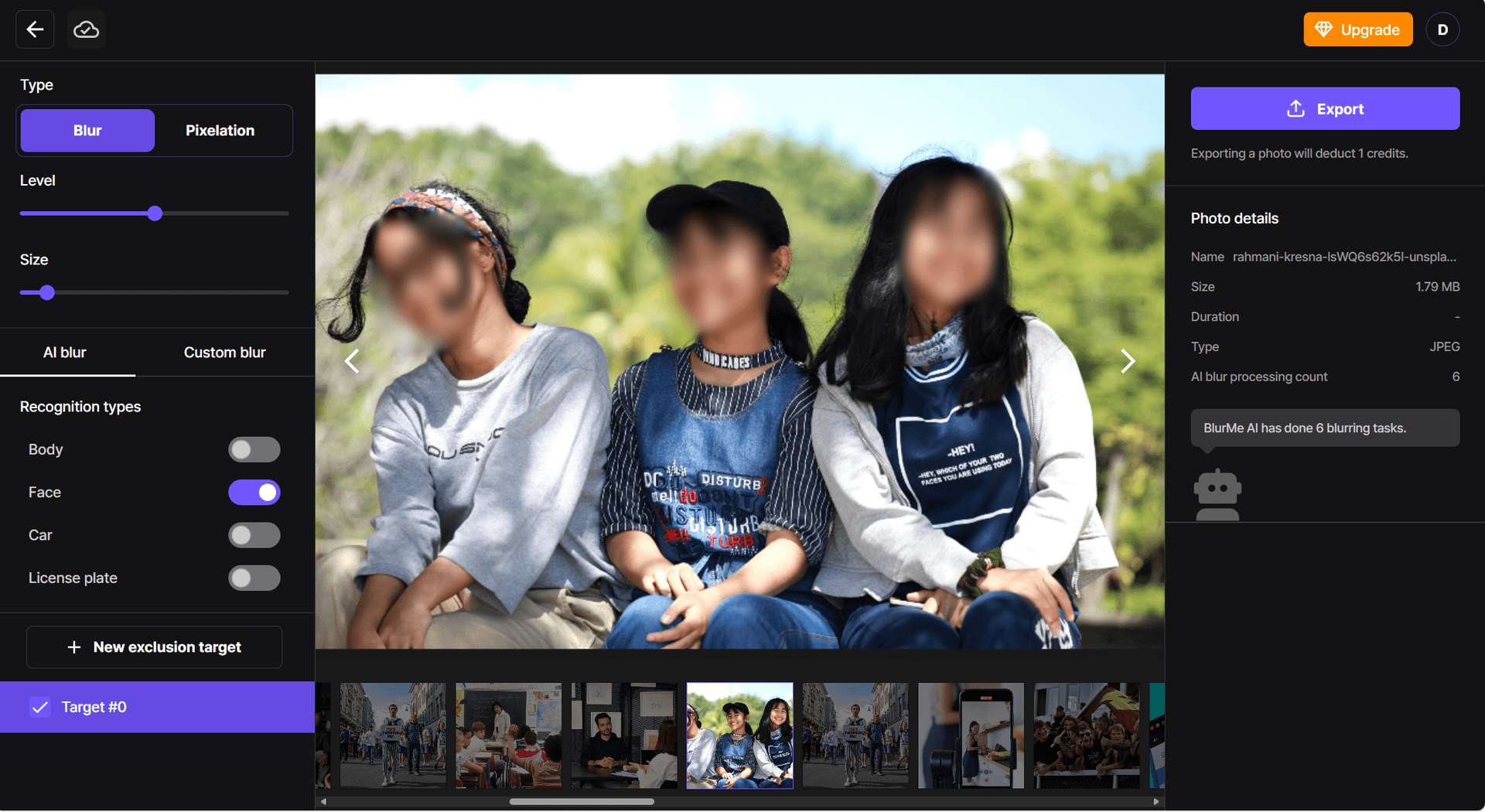 Schermata che mostra la foto esportata con volti sfocati per la privacy.