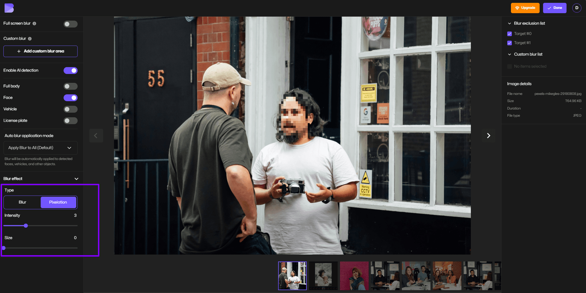 Adjusting pixelation on face in image.